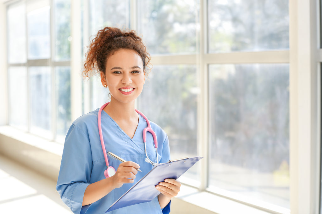 Nurse with pink stethoscope and 